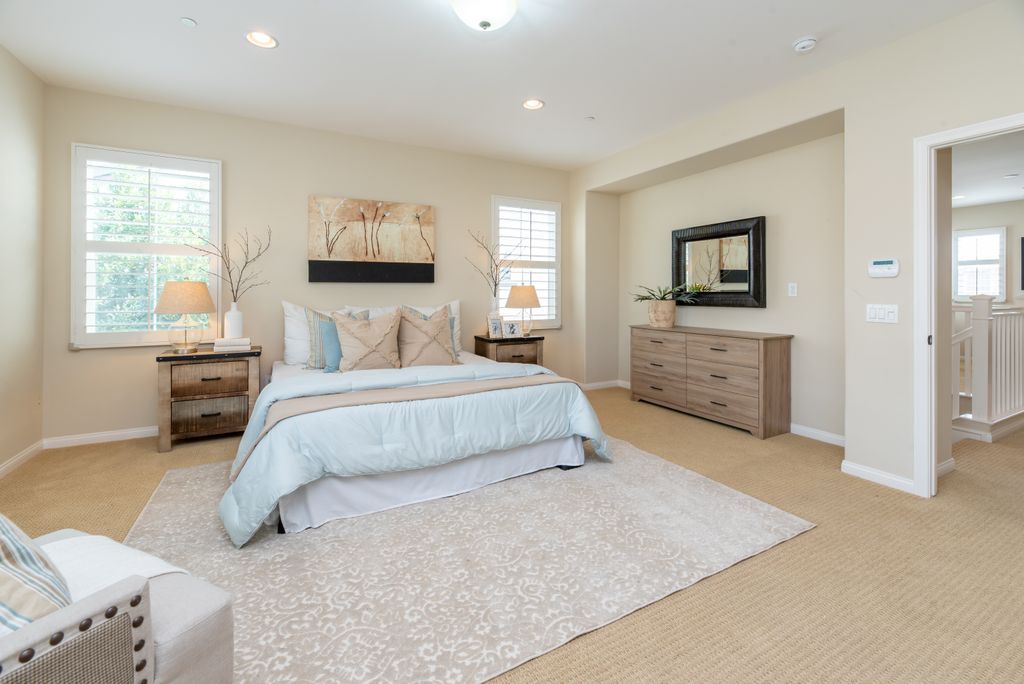 Bright modern bedroom with neutral decor and cozy ambiance, perfect for home decor inspiration.