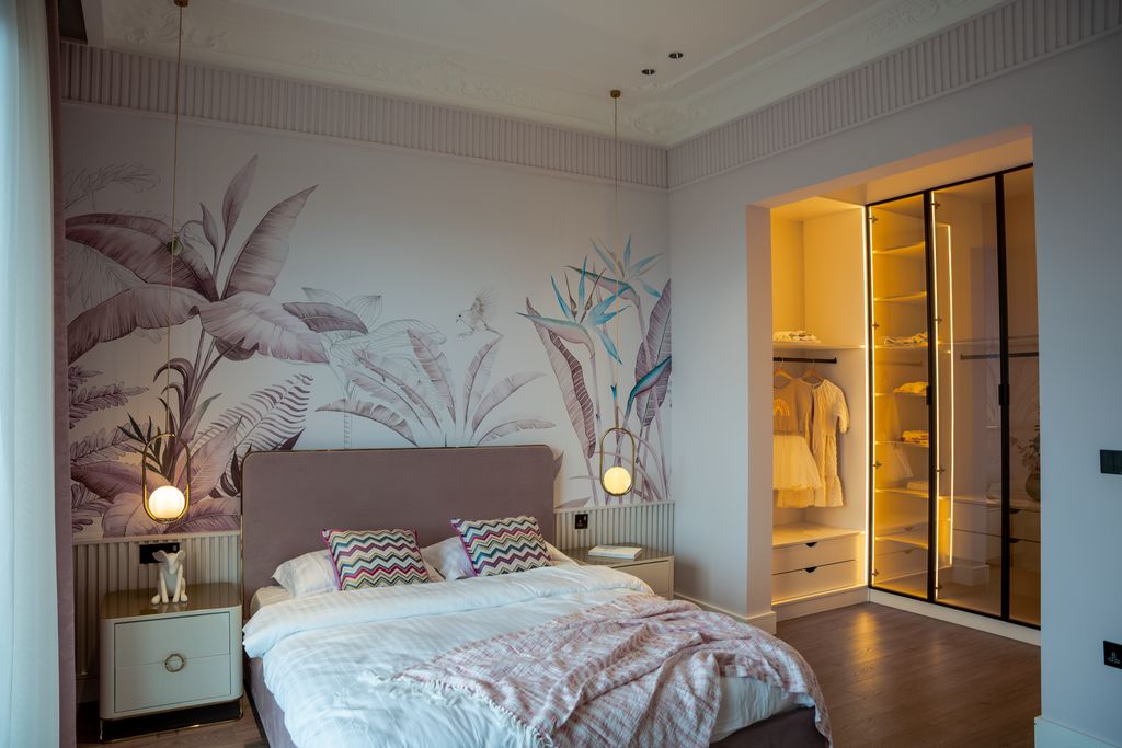Elegant bedroom with modern furnishings and soft lighting, showcasing luxury decor.