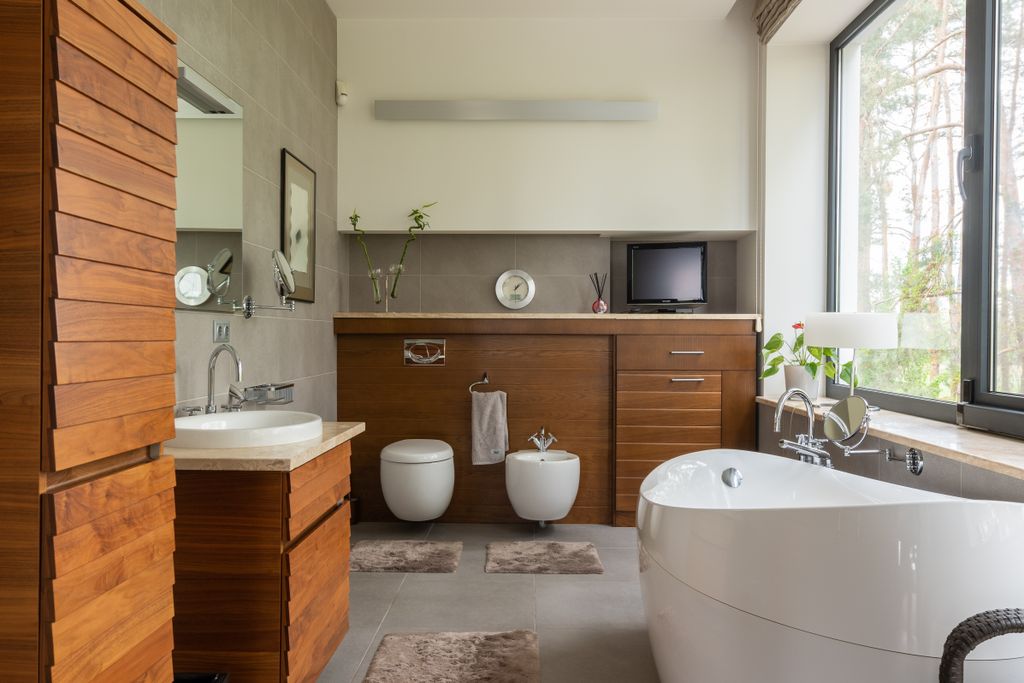 Bathroom Dimensions for Different Types of Bathrooms: A Complete Size Guide Interior of contemporary bathroom with timber furniture and white sink near mirror in daytime