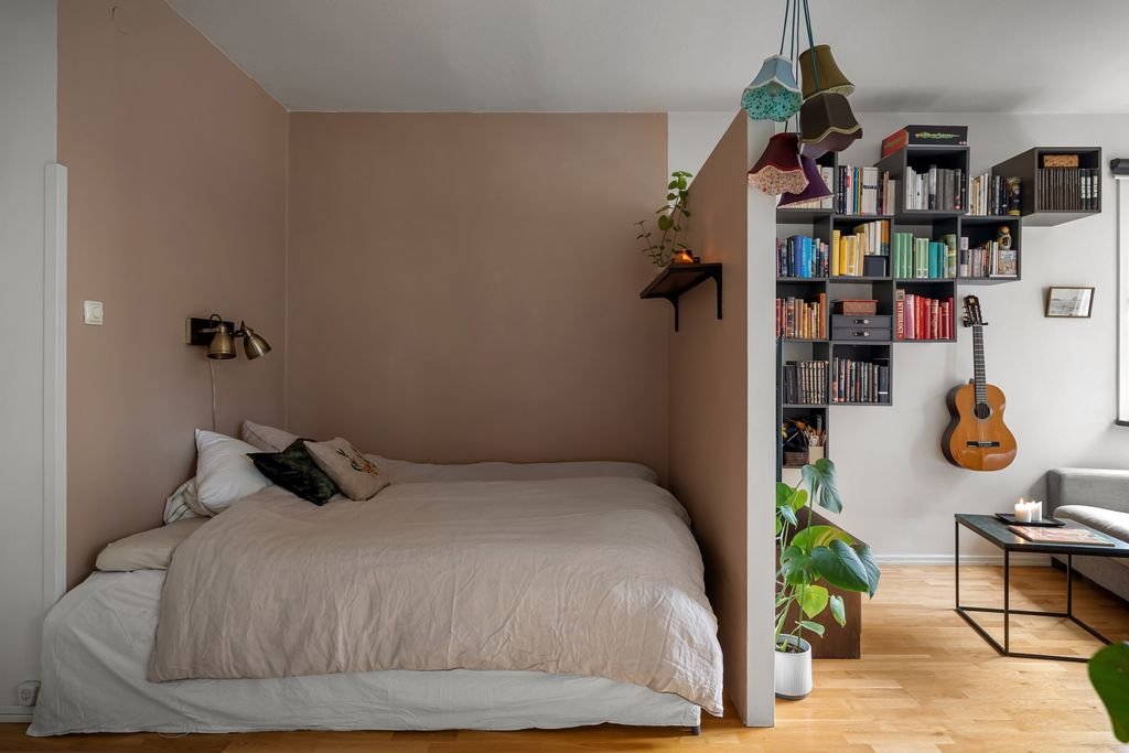 How to Decorate a Small Room: 31 Smart Ideas That Actually Work A contemporary bedroom with a double bed, guitar, and bookshelf, ideal for a cozy home setting.