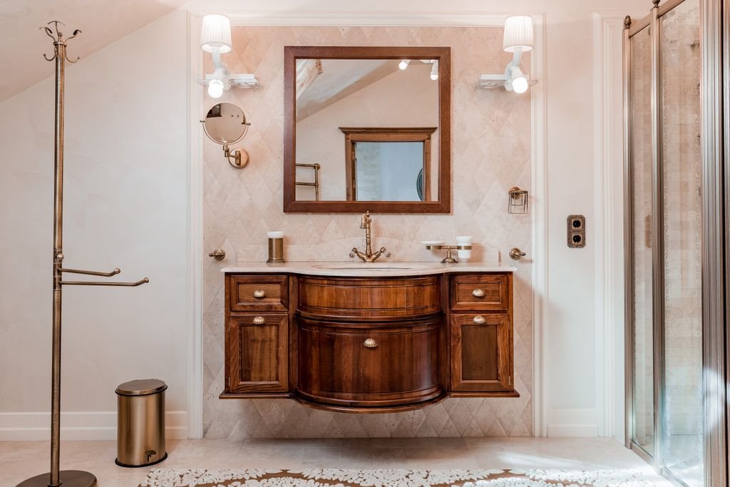 Bathroom Vanity Size Guide: How to Choose the Right Fit for Your Space Modern bathroom interior featuring a wooden vanity, mirror, and stylish fixtures in a luxurious setting.